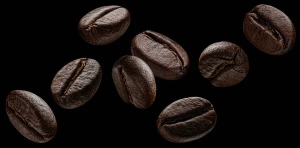 Fallende Kaffeebohnen Isoliert Auf Schwarzem Hintergrund Makro — Stockfoto