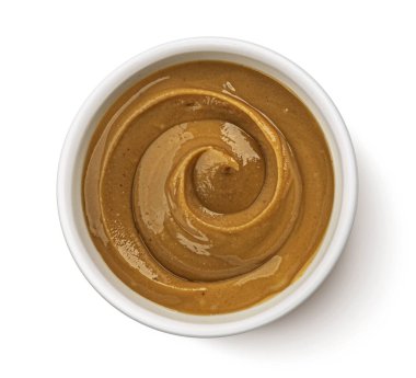 Beyaz arka plan üzerinde izole fıstık ezmesi Kase, üst görünümü