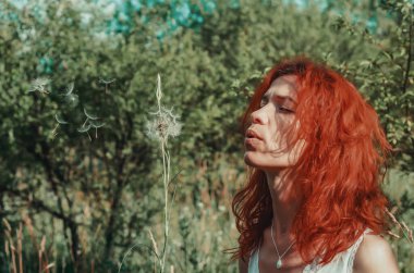 Red girl sells umbrellas from a big dandelion