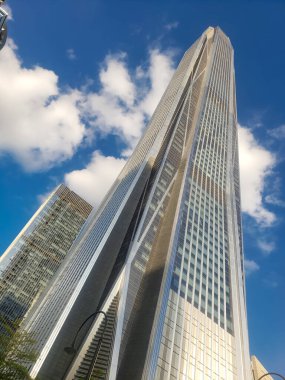Tall modern skyscraper against blue sky