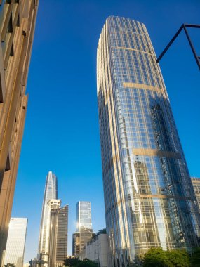 Tall modern skyscraper against blue sky