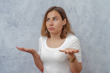 Young girl in an emotional state of misunderstanding, surprise