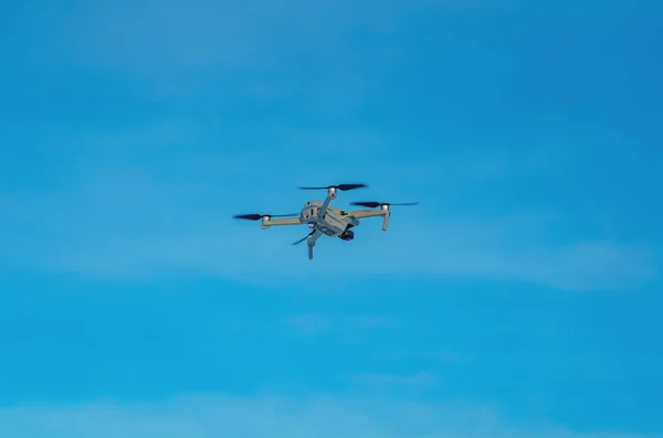 stock image Drone quadcopter against blue sky. Air shooting, aerial reconnaissance