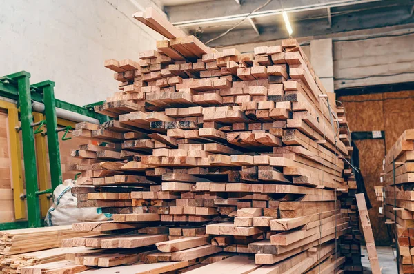 stock image The boards are stacked in a pile in carpentry shop