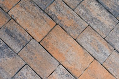 Dikdörtgen kaldırım taşları kare üzerine serilmiştir. Manzarayı kapat. Soyut taş arkaplanı.