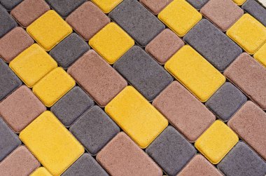 Geometrik şekilli renkli kaldırım taşları. Yan görüş. Soyut kaldırım taşı arkaplanı