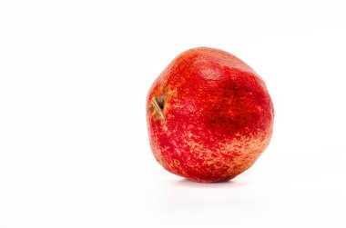 Ripe red pomegranate isolated on white background. Side view. Place for inscription