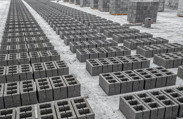 stock image View of concrete cinder blocks, building material in form of gray bricks. Production at factory