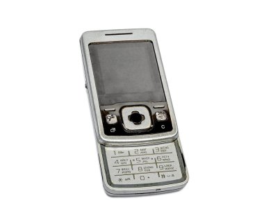 Nostalji için beyaz arka planda fiziksel tuş takımı olan eski bir cep telefonu.