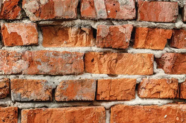 Çatlak ve Çimento Hatları olan Yaşlanmış Tuğla Duvarın Yakın Çekimi