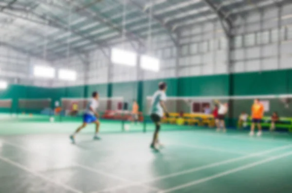 Athlètes Qui Jouent Badminton Sur Terrain Badminton Image Floue Photo De Stock
