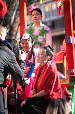 Madrid, Spain; 22nd January 2023: Close-up of young girls on the main float being interviewed, representing the symbol of the Chinese New Year, the Water Rabbit, in the Usera neighborhood, Madrid.