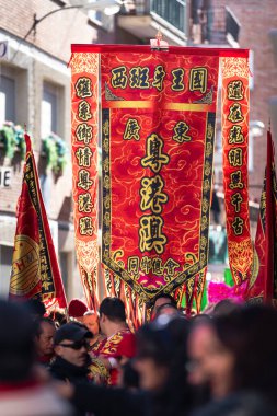Madrid, Spain; 22nd January 2023: Head of the Parade with Flags with Chinese New Year symbols in the Usera neighborhood, Madrid. Spain