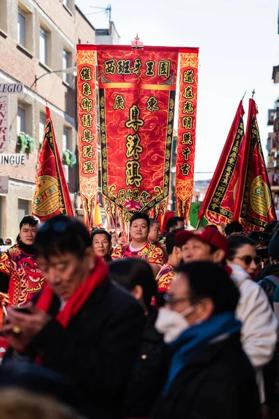 Madrid, Spain; 22nd January 2023: Head of the Parade with Flags with Chinese New Year symbols in the Usera neighborhood, Madrid. Spain