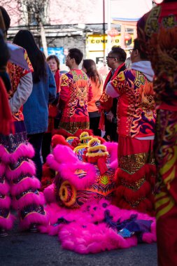 Madrid, Spain; 22nd January 2023: Participants in the Chinese New Year parade, dressed in traditional costumes , in the neighborhood of Usera, Madrid. Spain. With the dragon masks ready for use.