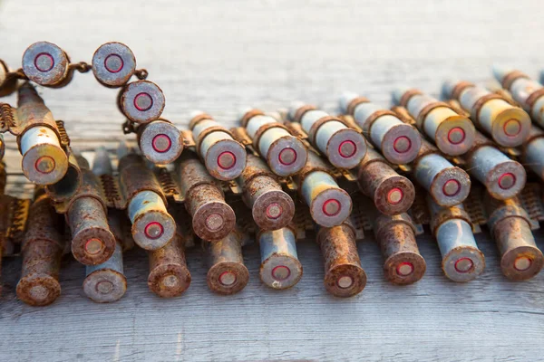 old rusty cartridges in a machine-gun belt. war in Ukraine. military ammunition