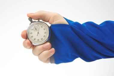 hand with a mechanical analog stopwatch on a white background. Time part precision. Measurement of the speed interval