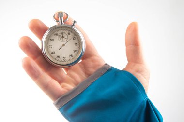 hand with a mechanical stopwatch on a white background. Time part precision. Measurement of the speed interval