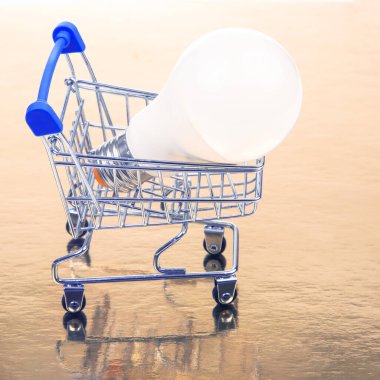 LED lamp in a grocery cart. Sales and marketing. Energy saving