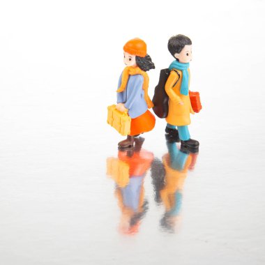 miniature people. figures for the game. romantic couple of young people. boy and girl walking together