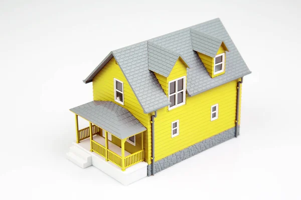 small model of an apartment building on a white background