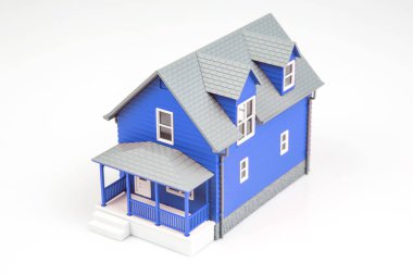 small model of an apartment building on a white background