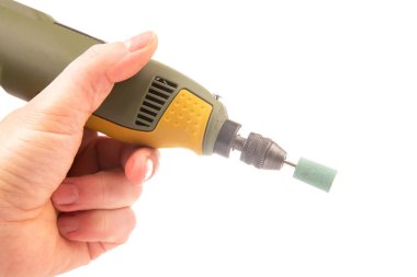 graver and drilling electric tool on a white background. dremel for processing materials and repairing parts