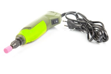 graver and drilling electric tool on a white background. dremel for processing materials and repairing parts