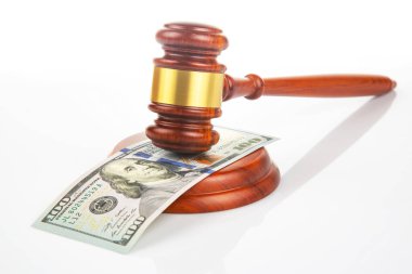 gavel of justice on the background of dollars. corruption in law. buying a judgment