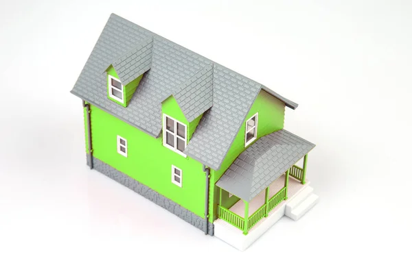 small model of an apartment building on a white background