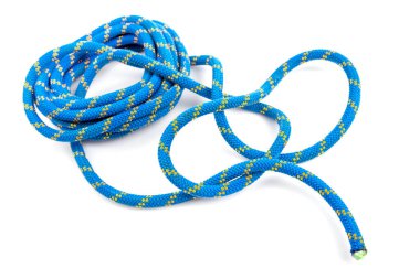 durable colored rope for climbing equipment on a white background. knot of braided cable. item for tourism and travel