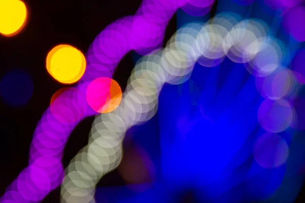 stock image background blurred abstraction of colored lanterns and decorations. bokeh texture of street colored lights