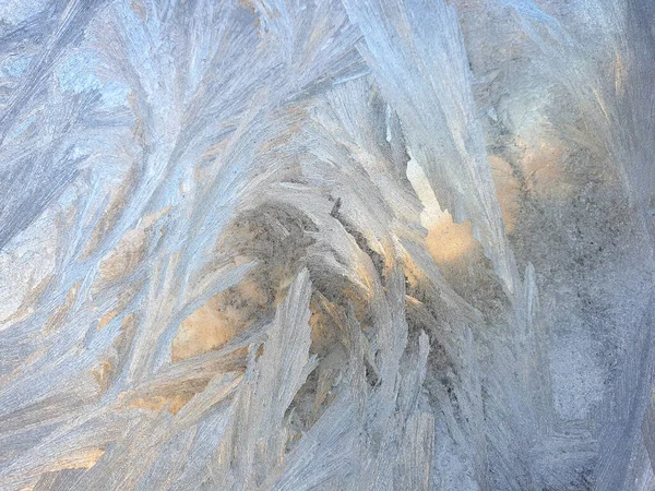 stock image frosty patterns on the window glass closeup. natural textures and backgrounds. ice patterns on frozen