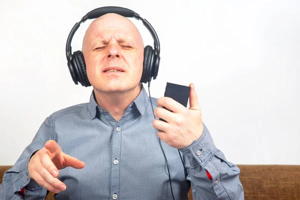 Man Closed Eyes Listens Music Headphones Light Background Royalty Free Stock Photos