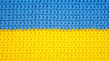 knitted scarf in the form of the Ukrainian flag. national symbols of the country Ukraine