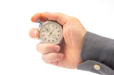 hand with a mechanical analog stopwatch on a white background. Time part precision. Measurement of the speed interval