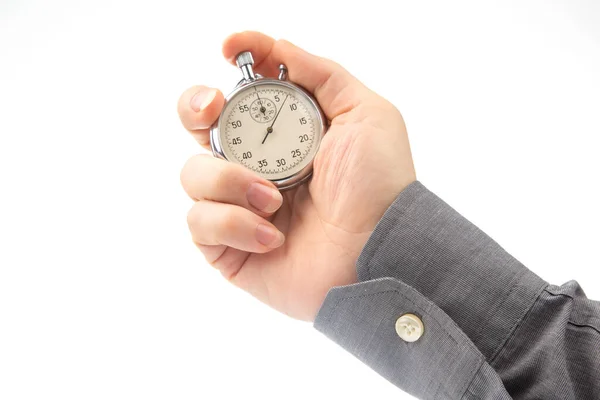 stock image hand with a mechanical analog stopwatch on a white background. Time part precision. Measurement of the speed interval
