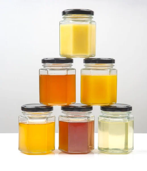 Hexagonal Jars Different Types Colors Fresh Flower Honey Vitamin Food — Stock Photo, Image