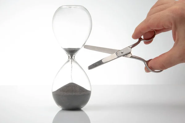 Hand Scissors Hourglass Time Stop Concept Stock Photo