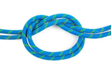 durable colored rope for climbing equipment on a white background. knot of braided cable. item for tourism and travel