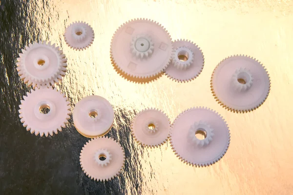 white plastic gears. connection mechanism details. subject of movement