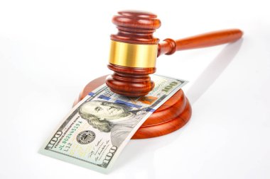 gavel of justice on the background of dollars. corruption in law. buying a judgment