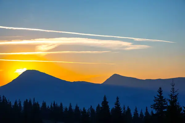 Morning sunrise over the top of a mountain in the Ukrainian Carpathians