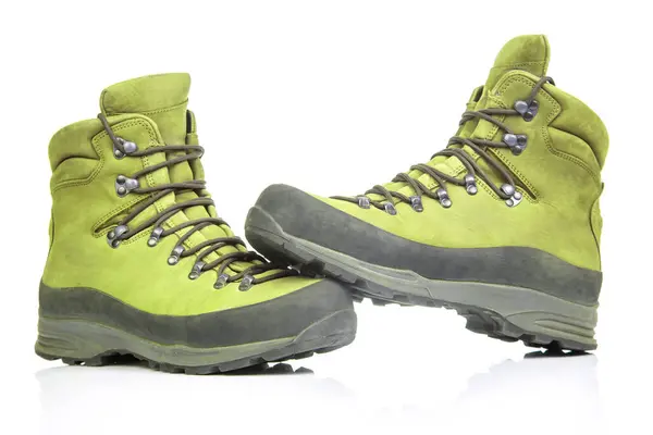 Trekking boots for hiking on a white background. Equipment for travel and hiking