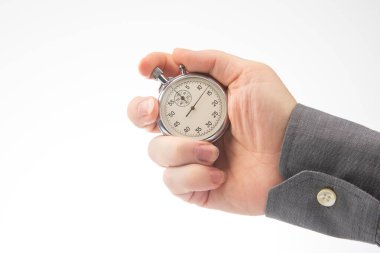 hand with a mechanical analog stopwatch on a white background. Time part precision. Measurement of the speed interval