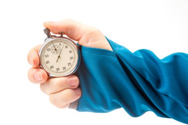hand with a mechanical analog stopwatch on a white background. Time part precision. Measurement of the speed interval