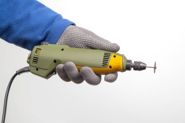 graver and drilling electric tool on a white background. dremel for processing materials and repairing parts
