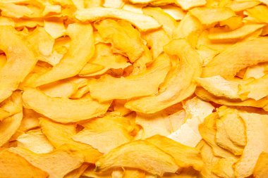 Kurutulmuş kavun dilimlerinin dokusu ve arkaplanı. Meyve ve vitamin. Sağlıklı yemek..