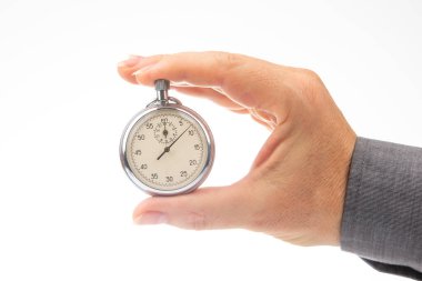 hand with a mechanical analog stopwatch on a white background. Time part precision. Measurement of the speed interval