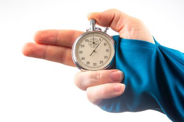 hand with a mechanical analog stopwatch on a white background. Time part precision. Measurement of the speed interval